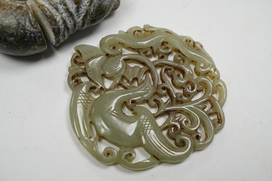 A 19th century Chinese reticulated celadon jade disc, 6.5cm diameter, a Ming style peach shaped brushwasher and a neolithic style carving. Condition - good